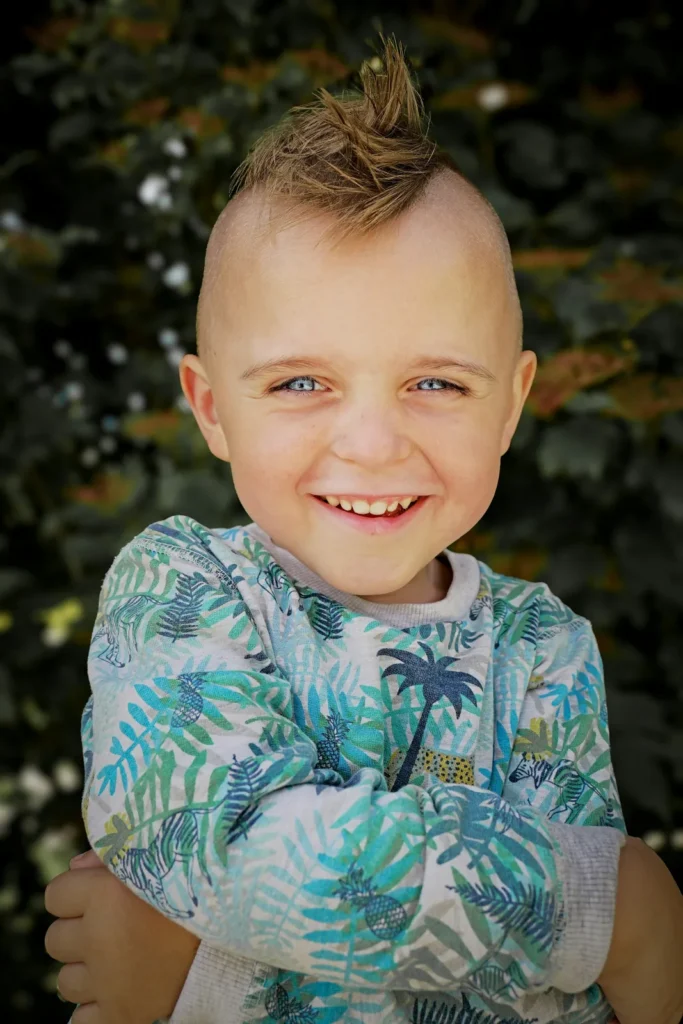 Laughing boy with a little mohawk
