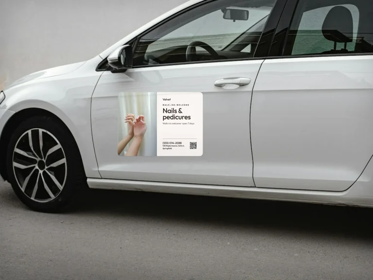 A nail salon car magnet on a white car door