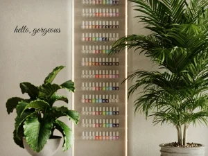 Script lettering on a nail salon wall beside the polish rack