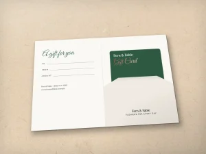 An open gift card holder: message on the left, the plastic card in the pocket on the right