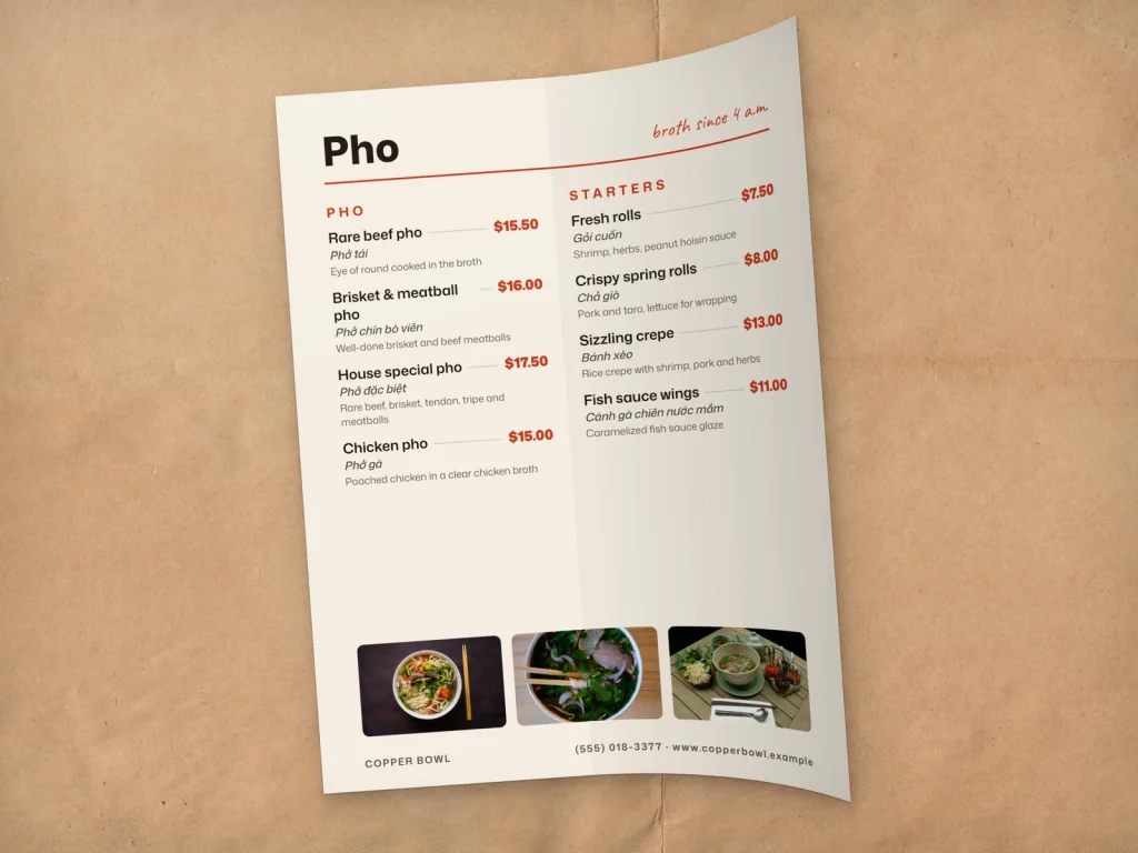 A flexible plastic menu insert bending without creasing, from a pho restaurant