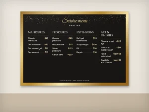 A nail salon wall menu in a gold frame