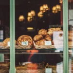 Bakery window with croissants and bread