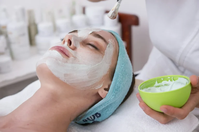 Client having a facial mask at a spa