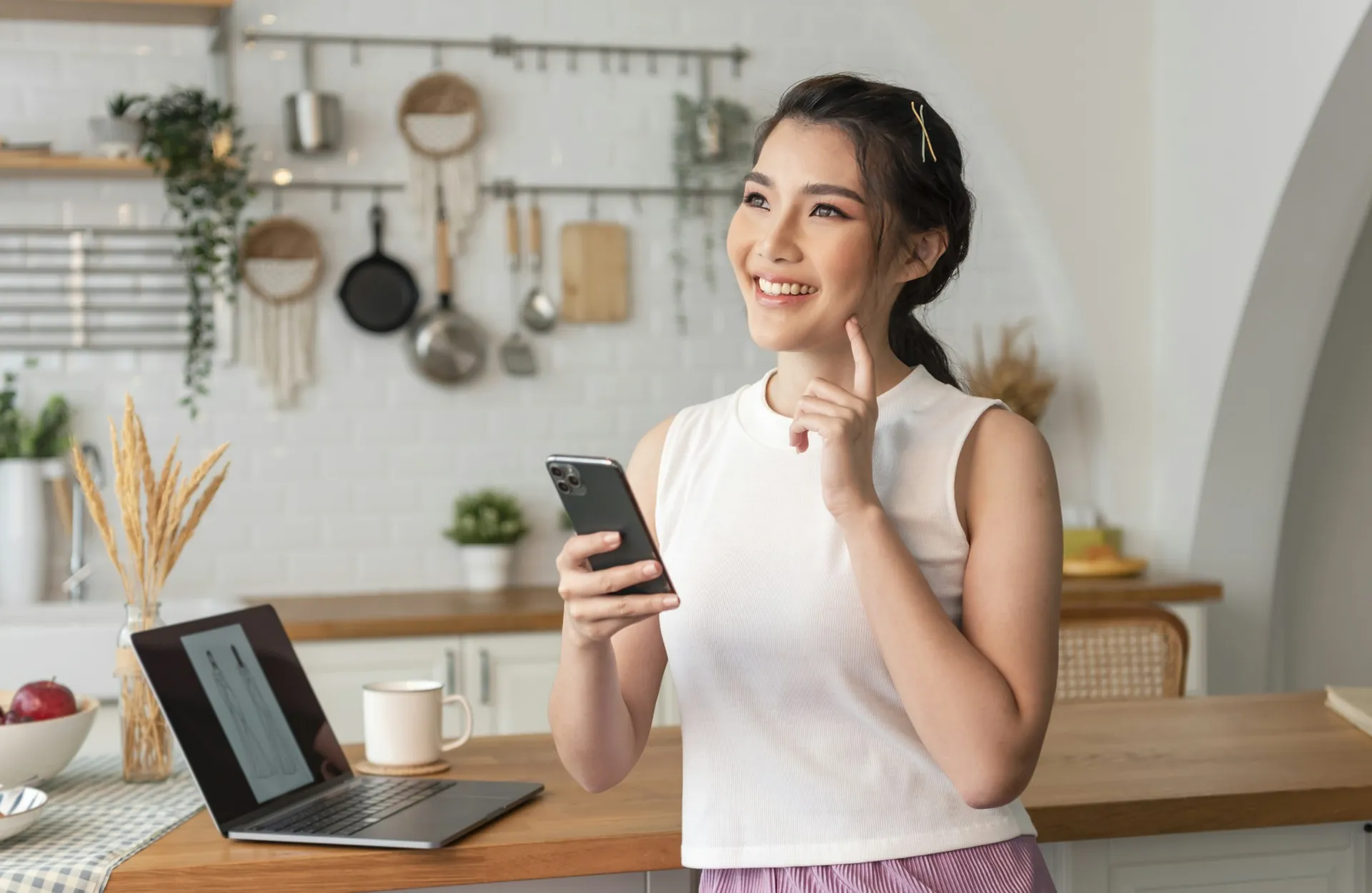 A salon owner checking calls and direction requests from Google on her phone