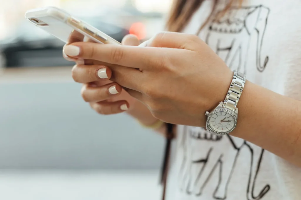 A client booking an appointment on her phone