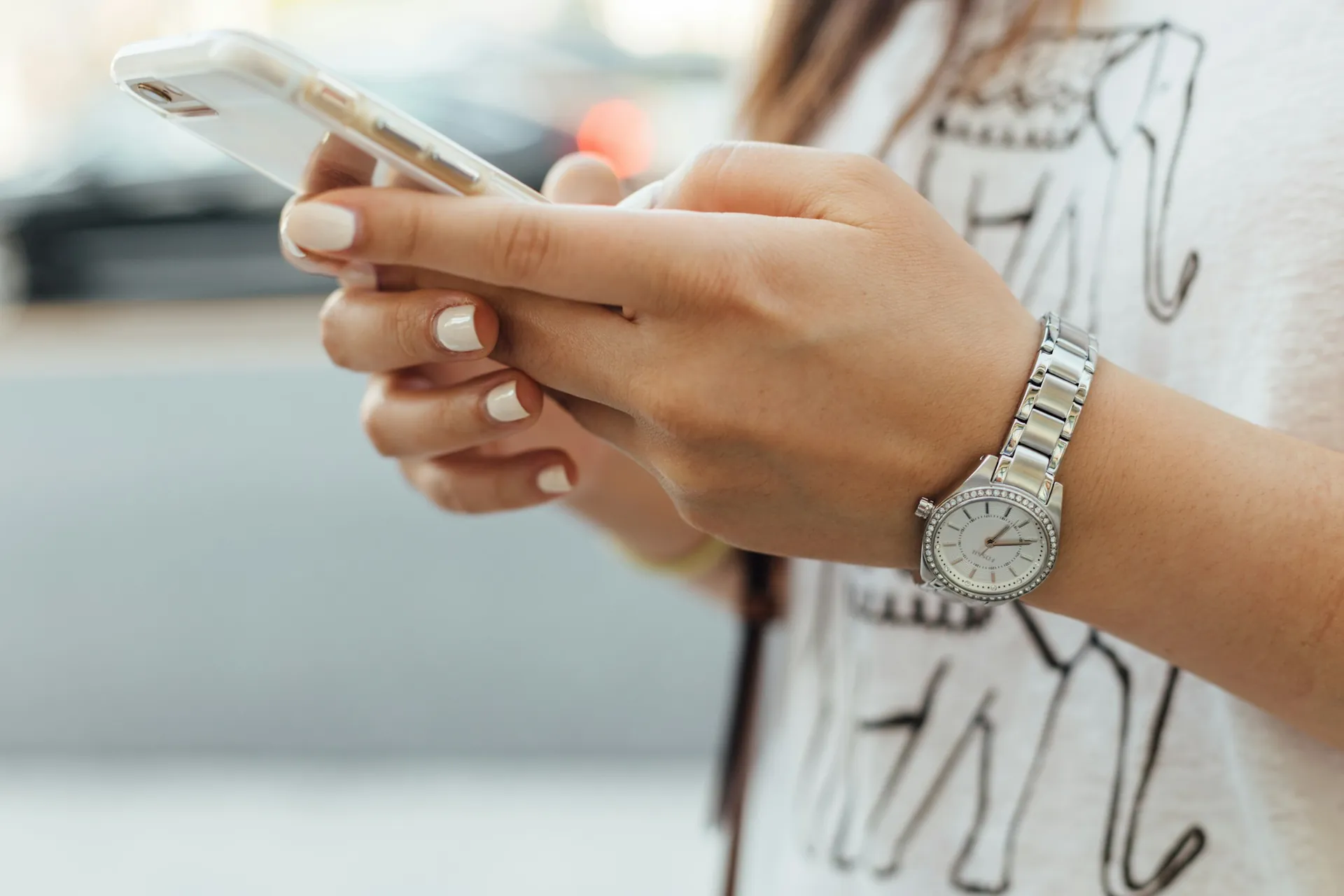 A client booking an appointment on her phone