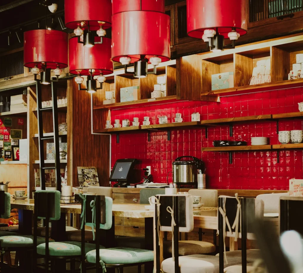 Vietnamese eatery with red lamps and a tiled counter