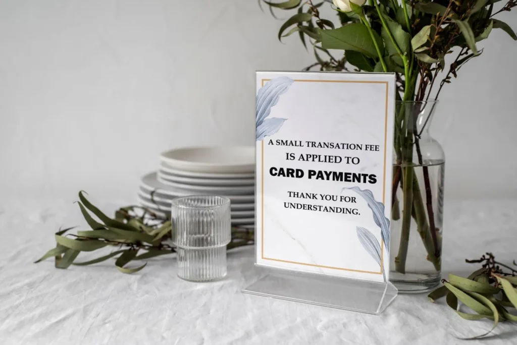 A counter sign keeps the salon cancellation policy visible at check-in and checkout