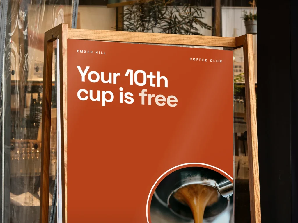 A-frame sign template AF-07 for a bakery or café: Ember Hill, big orange type with an espresso pour