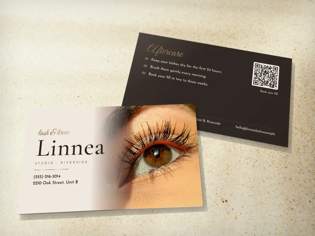Business card template BC-06 for a lash and brow studio: Linnea, cream with a lash close-up fading into the type