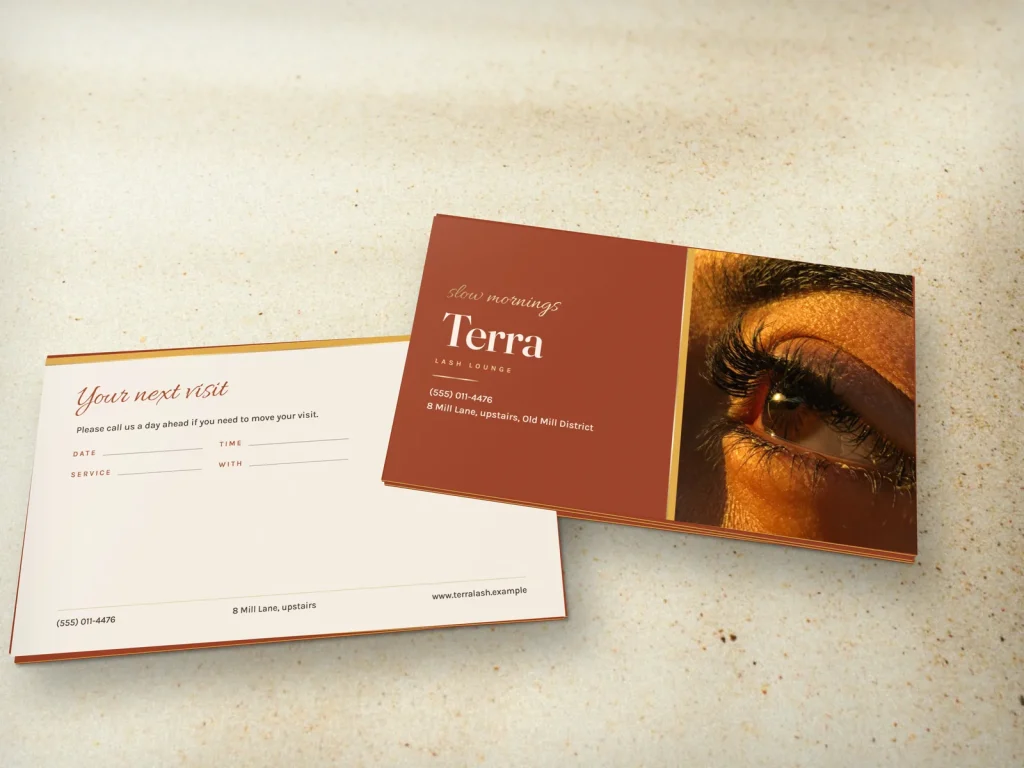 Triple-layer business card template BL-08 for a lash and brow studio: Terra, terracotta with a lash photo in golden light