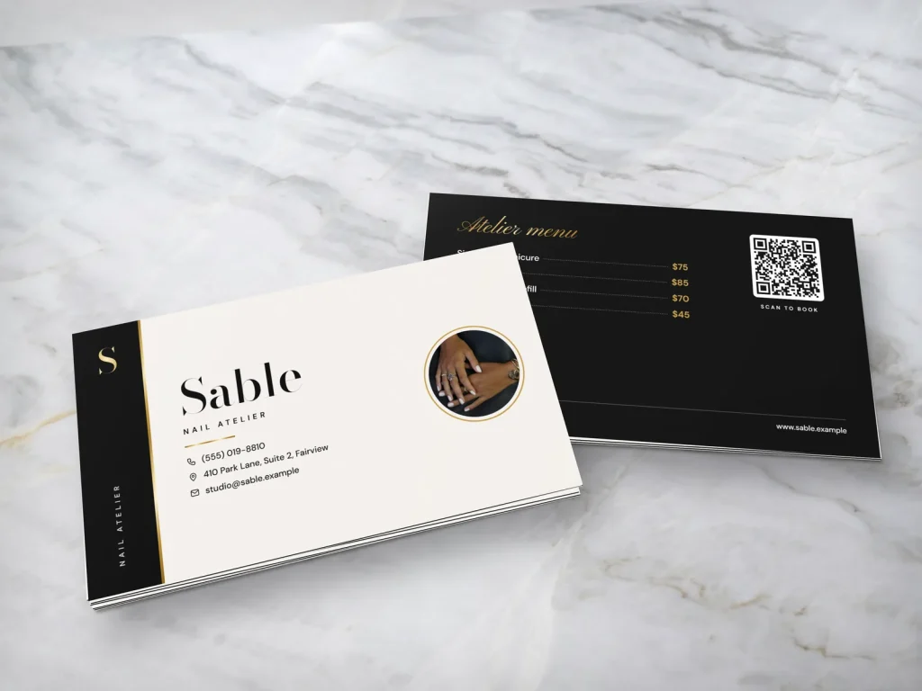 Triple-layer business card template BL-13 for a nail salon: Sable, ivory white with a black band, gold foil edge and milky nails photo