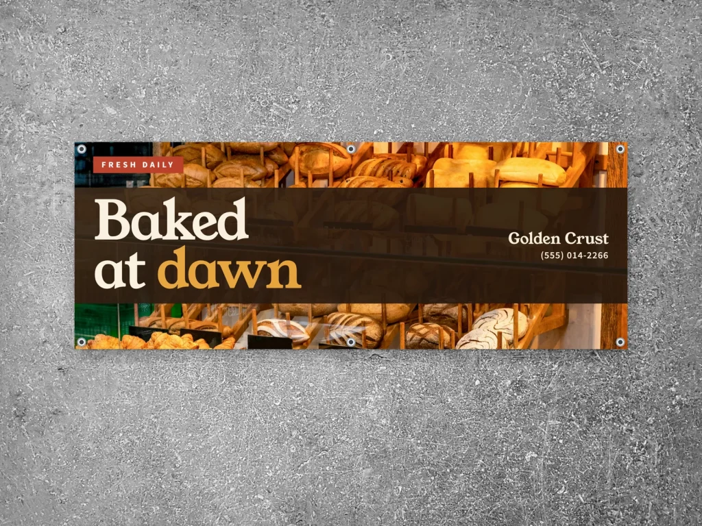 Vinyl banner template BN-06 for a bakery or café: Golden Crust, bread wall photo with a band of type