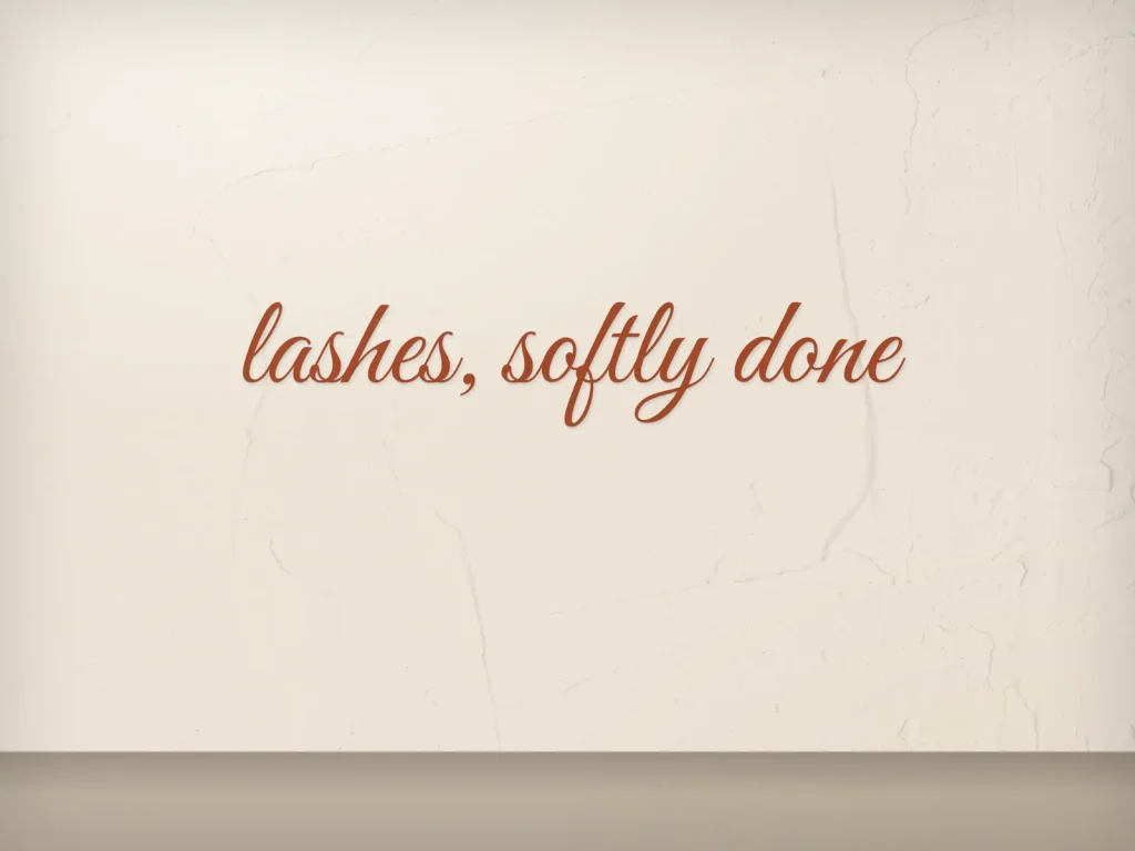 Cut vinyl lettering template CV-03 for a lash and brow studio: Linnea, terracotta script on a cream wall