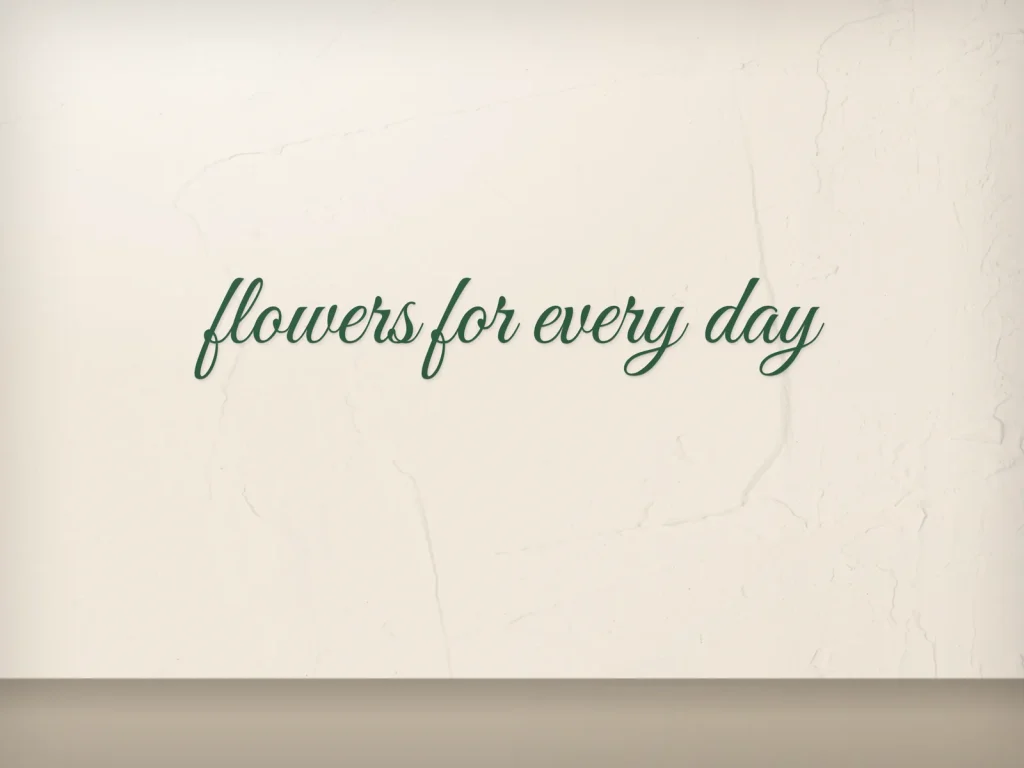 Cut vinyl lettering template CV-17 for a shop: Fern & Fable, green script on a cream wall