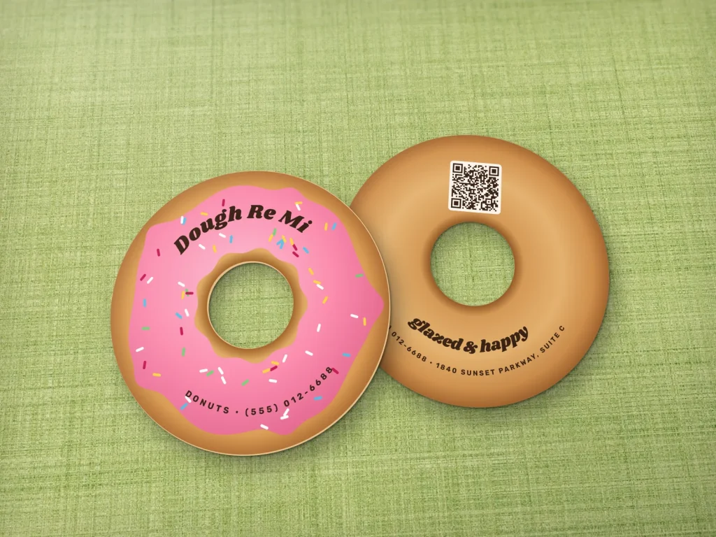 Die-cut business card template DC-15 for a bakery or café: Dough Re Mi, donut shape with a hole, pink glaze and sprinkles