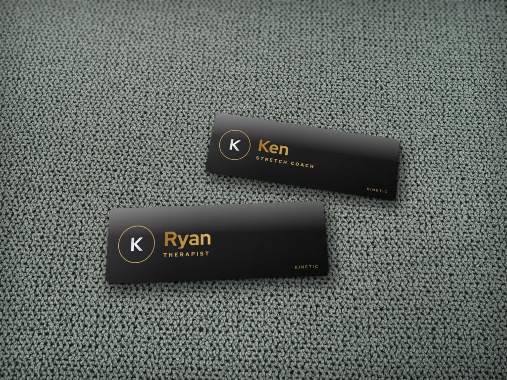 Mẫu name tag NT-10 cho spa: Kinetic, nền đen chữ vàng cho tiệm massage